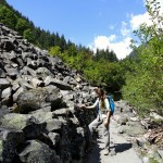 A hiker admires the great talus wall