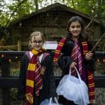 two kids dressed up for Halloween as harry potter wizards